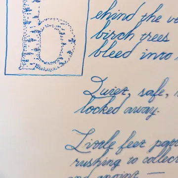 A page of a Penmanship member’s hand lettering: a drawn drop cap and lines in blue ink