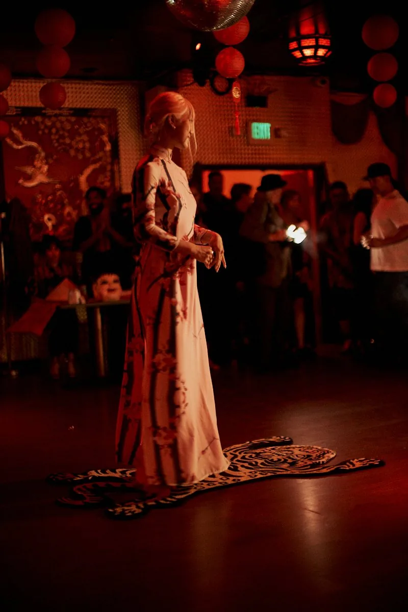 Angela in Vietnamese áo dài on runway