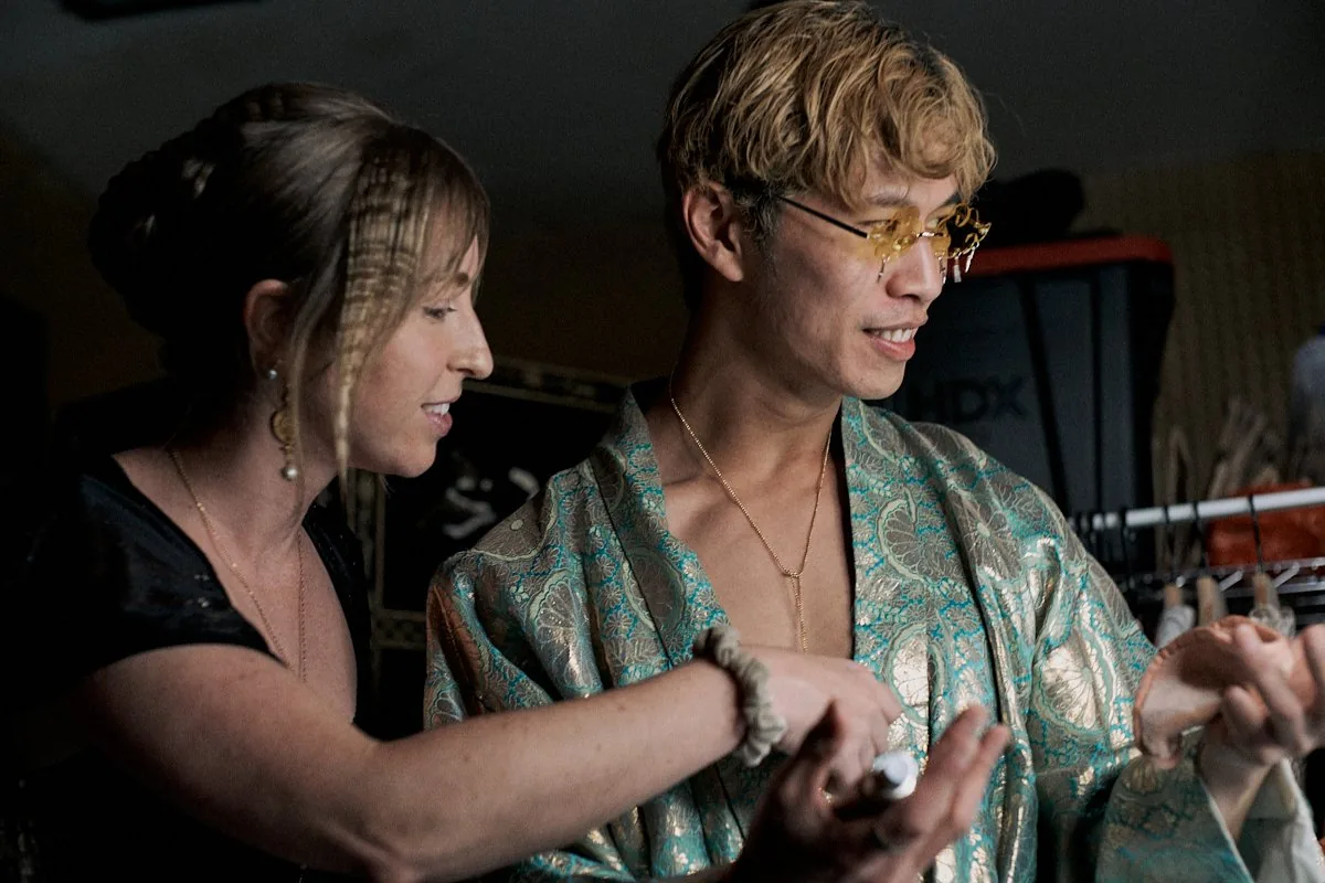 Falcon backstage with stylist