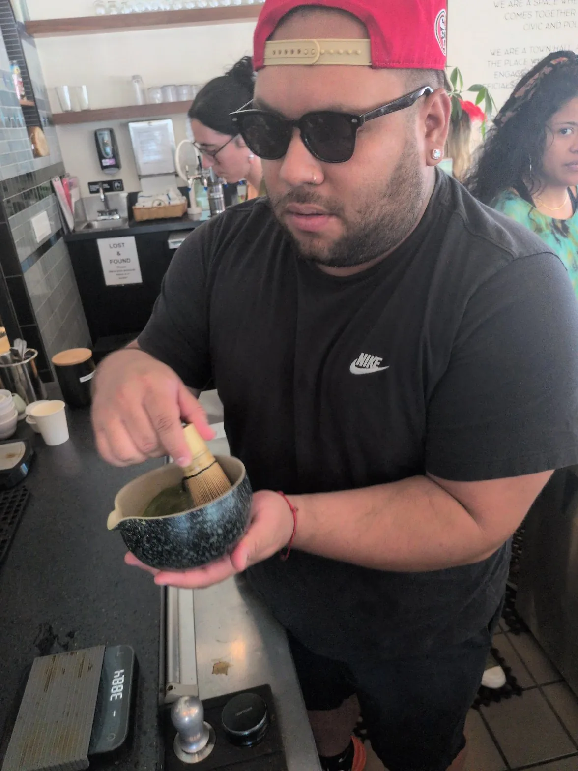Mauricio whisking matcha